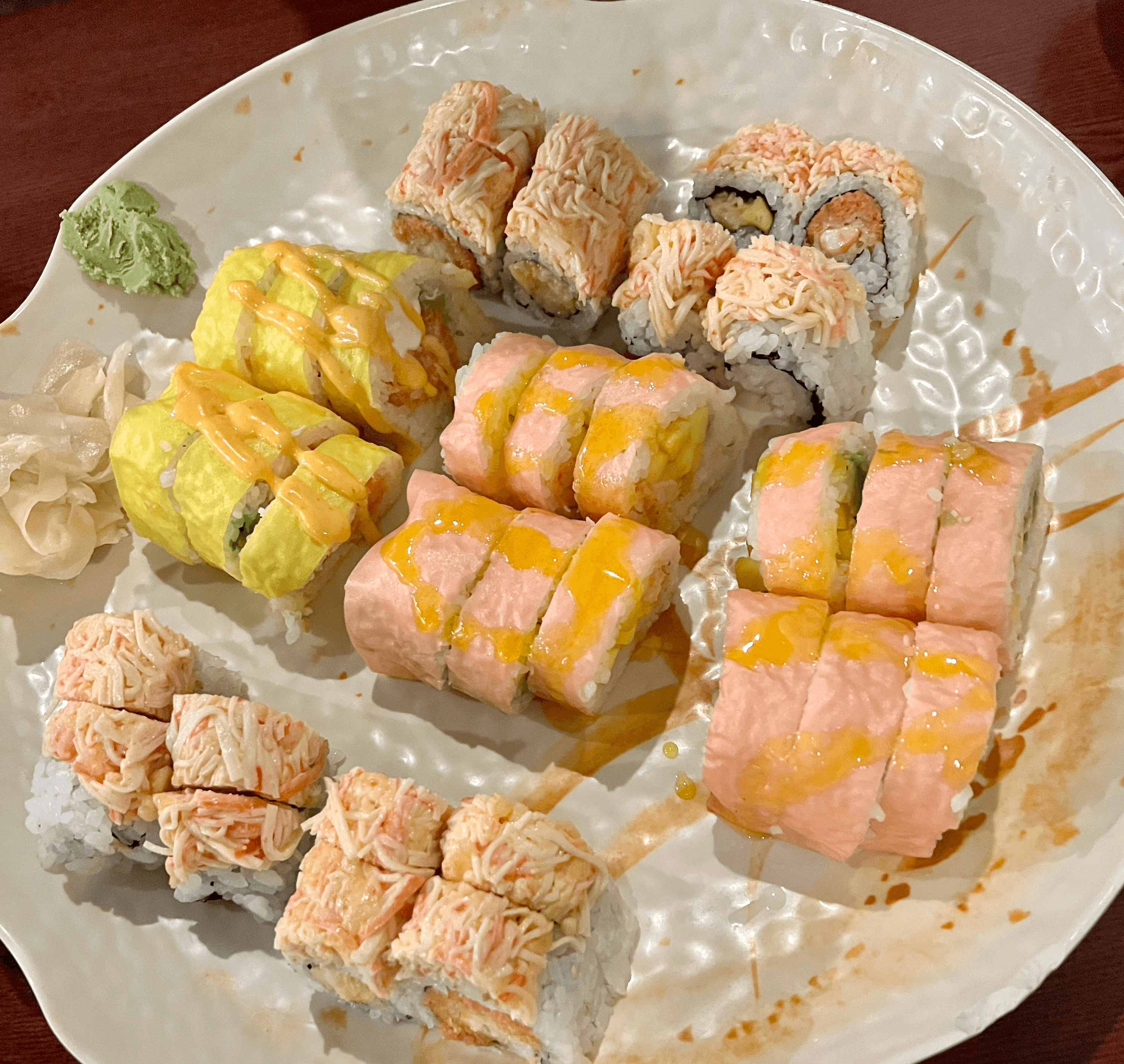 A lot of sushi with wasabi and ginger